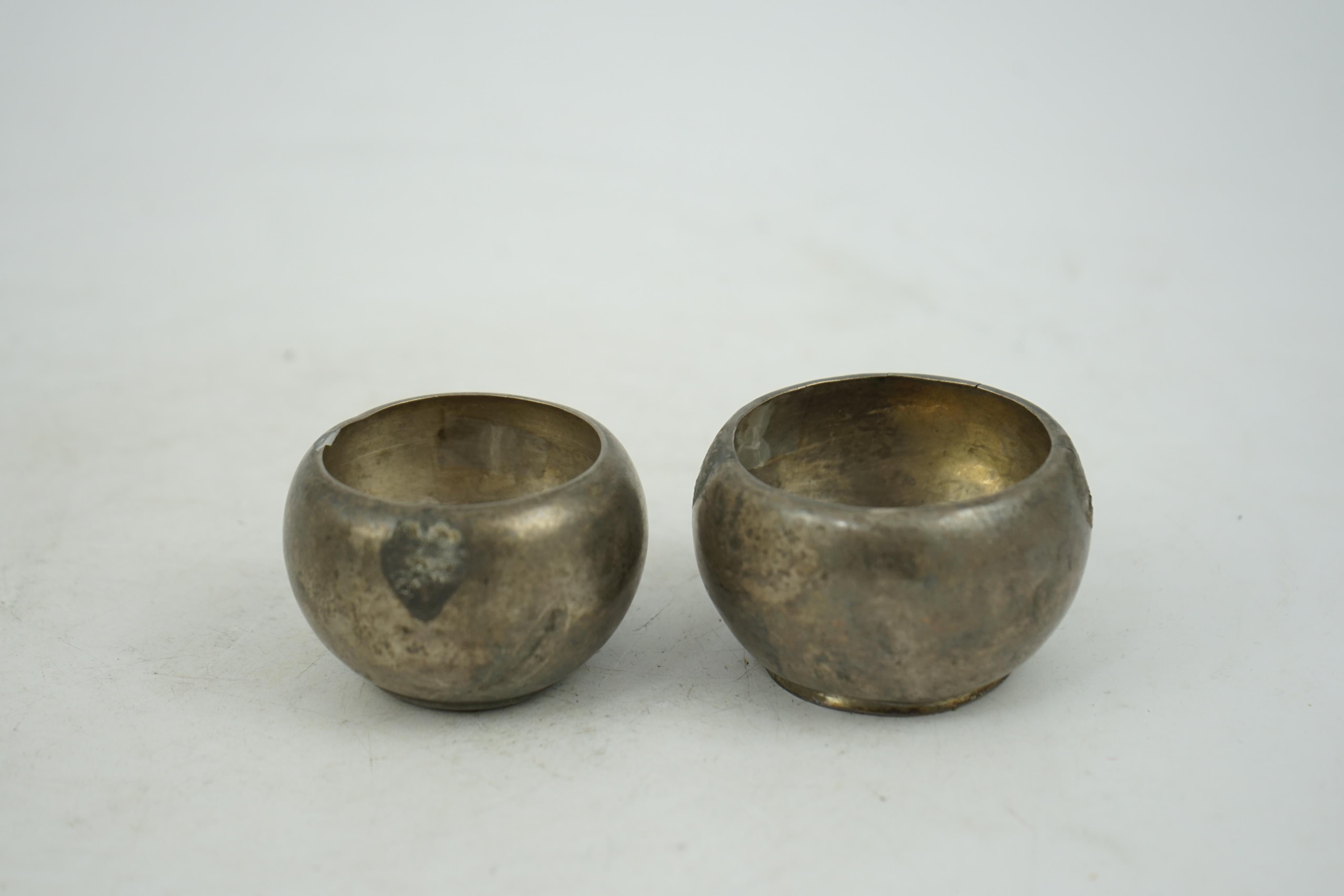 Two silver aryballoi, lacking handles, Roman or Gandhara, c. late 1st century BC - early 1st century A.D.